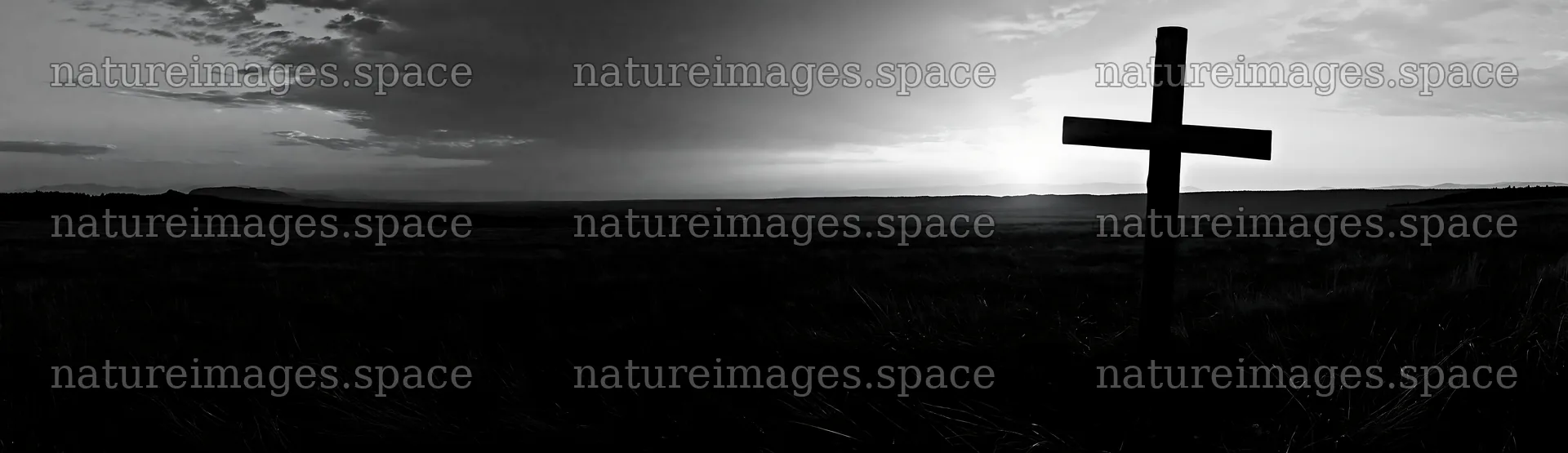 Christian cross in meadow at sunrise – nature images 14762x4268