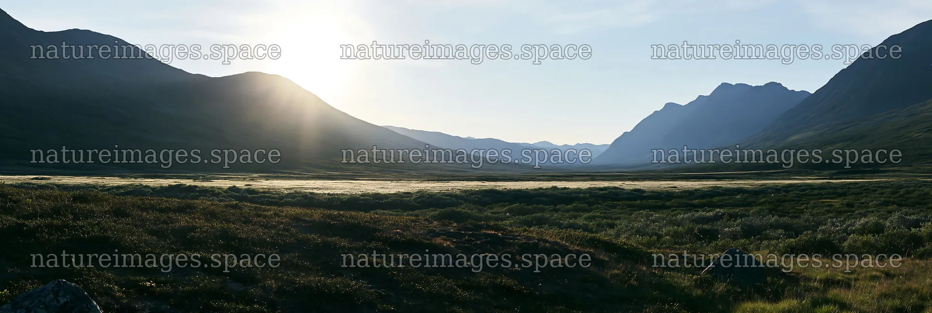 Sunbeams shine over Jotunheimen valley meadow – nature images 13690x4602