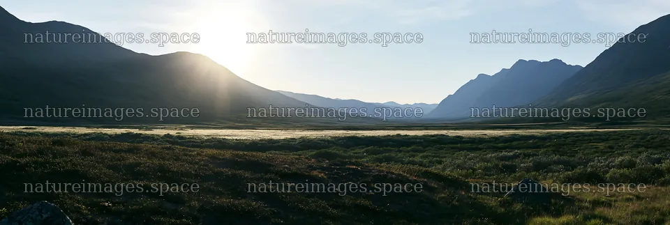 Sunbeams shine over Jotunheimen valley meadow – nature images 13690x4602
