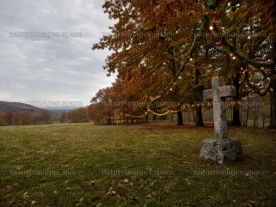 Aged Christian cross in autumn valley meadow – nature images 9166x6874