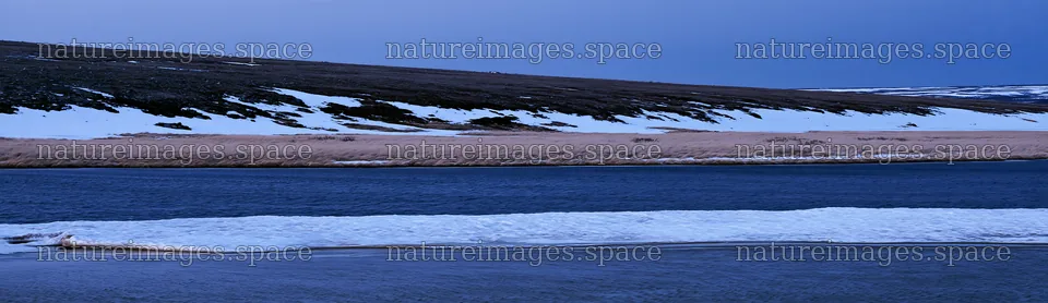 Snowy highland meadow with river and distant hills – nature images 14762x4268