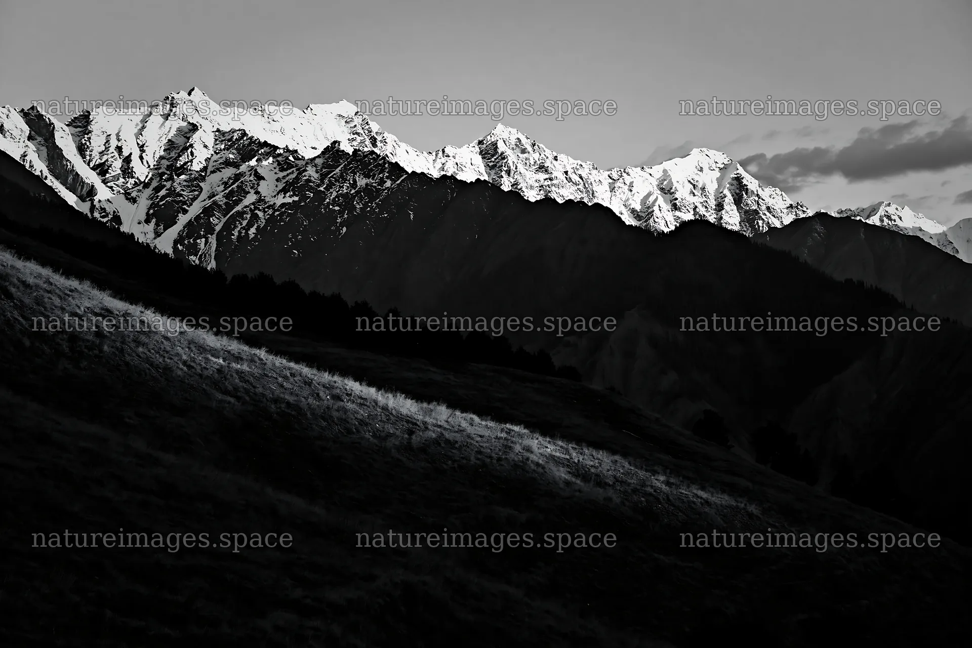 Sunset over mountains with snow and dark valleys – nature images 9722x6480