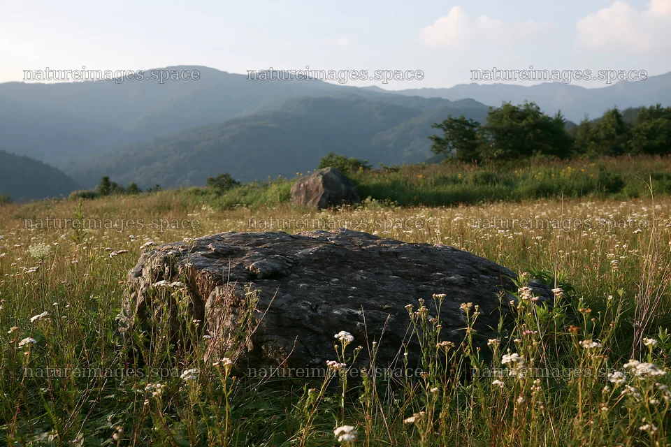 Nagano meadow with granite boulder and distant mountains – nature images 9722x6480