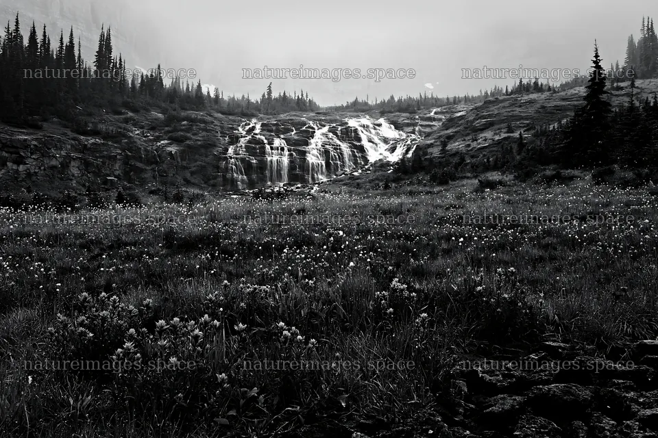 Misty mountain waterfall in a meadow during overcast weather – nature images 9722x6480
